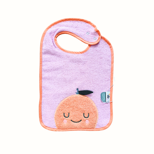 Babyhaklapp i frotté – Mandy Mandarine från The Cotton Cloud