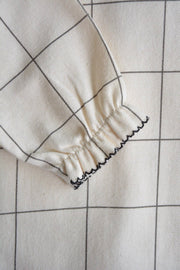 Dalila rutig babyblus i bomull
