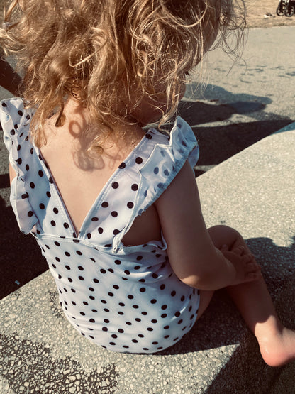 Baby swimwear for girls - White baby swimsuit with small, delicate dots and bold edges