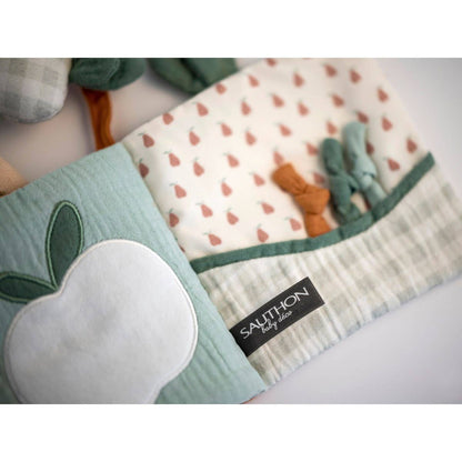 Mjuk babybok – Botanica tygbok med sensorik & ljud (15×19×4 cm)